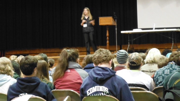 Lauren Traister (4-H Teen & Leadership Program Coordinator from UVM Extension) addresses the 240+ students from all over Vermont at the Youth Environmental Summit at the Barre Civic Center.